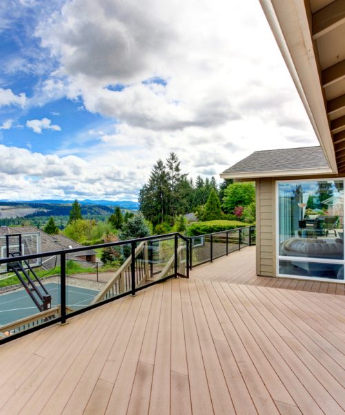 Screened walkout deck with tennis court view